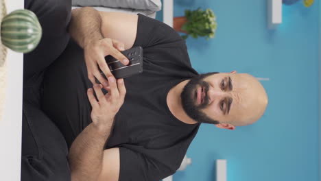 Vertical-video-of-The-man-who-got-bad-news-on-the-phone.